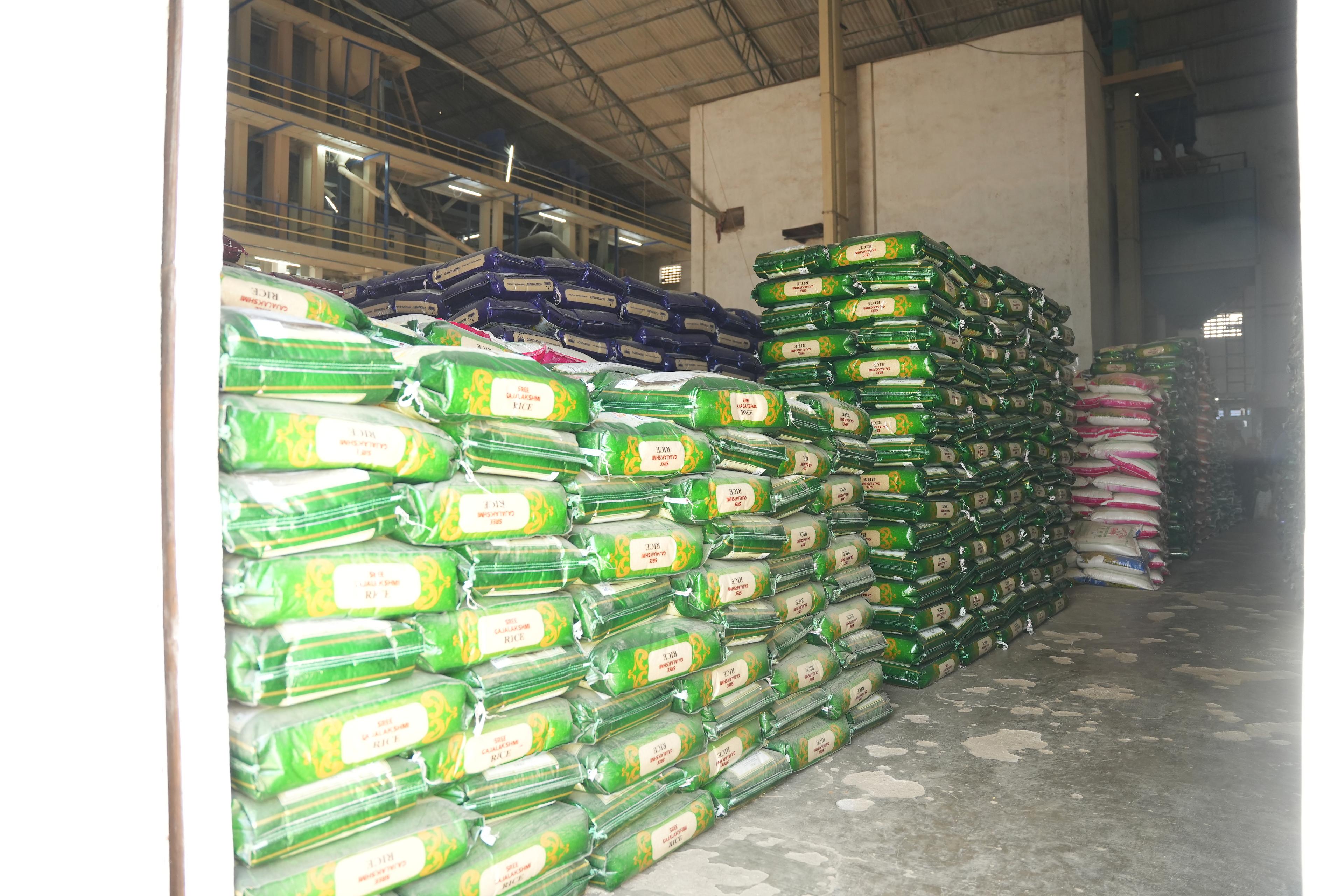 Stacks of packed rice bags in the Gowthamee warehouse